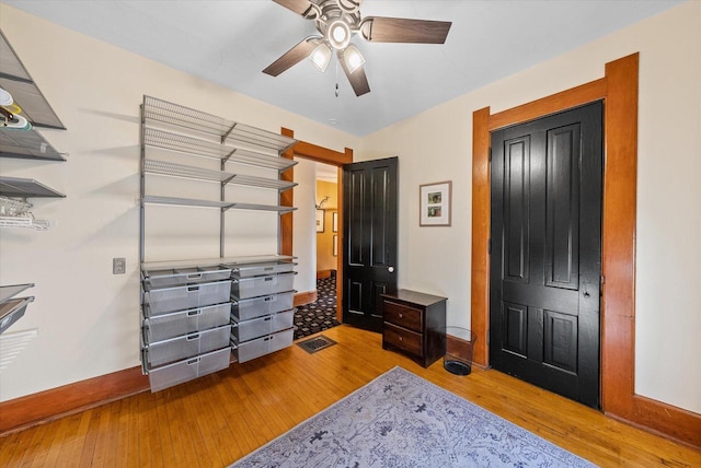 bedroom with light wood-type flooring and ceiling fan