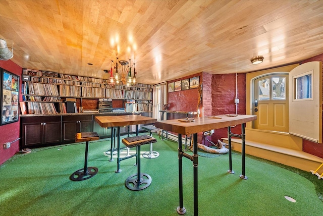 playroom featuring wooden ceiling and carpet