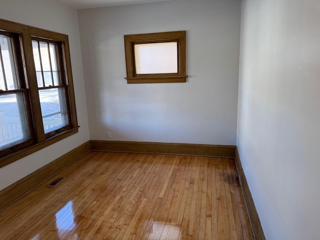 spare room featuring light wood-type flooring