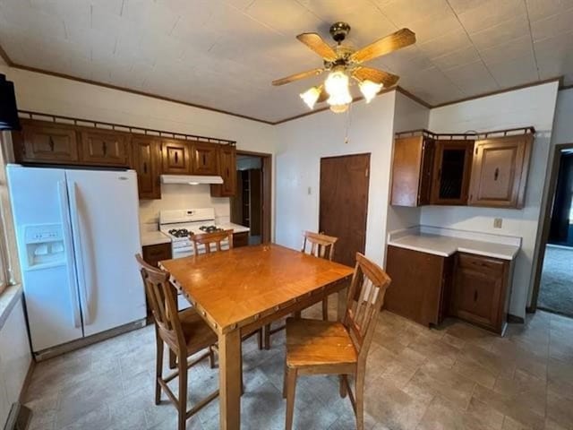 dining room with ceiling fan and ornamental molding