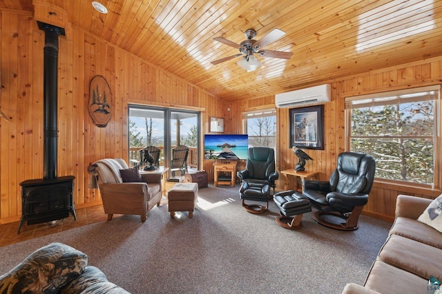 carpeted living room with a wood stove, ceiling fan, wooden ceiling, a wall mounted AC, and lofted ceiling