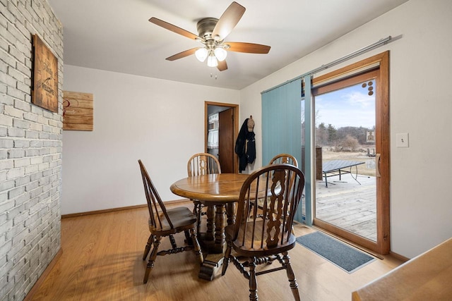 dining room featuring ceiling fan and light hardwood / wood-style flooring