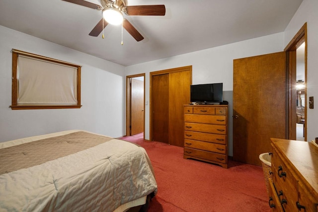 carpeted bedroom with a closet and ceiling fan