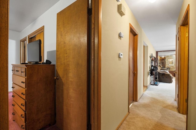 hallway with light colored carpet