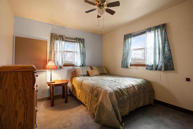 bedroom with ceiling fan and light carpet