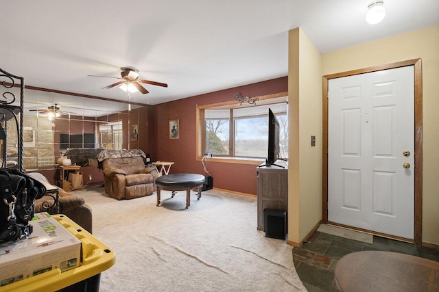 living room featuring ceiling fan and carpet floors