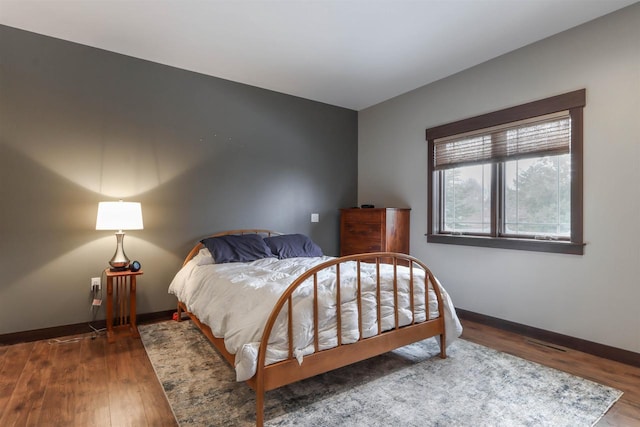 bedroom featuring hardwood / wood-style flooring