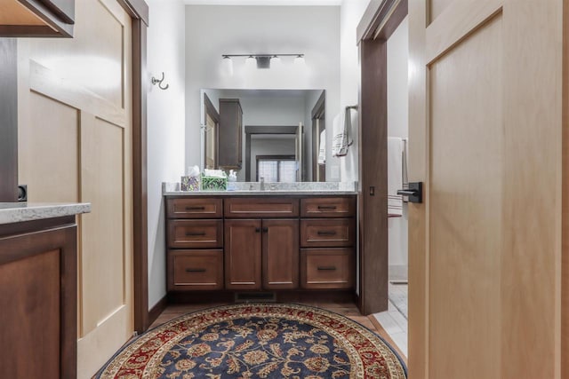 bathroom with tile patterned floors and vanity