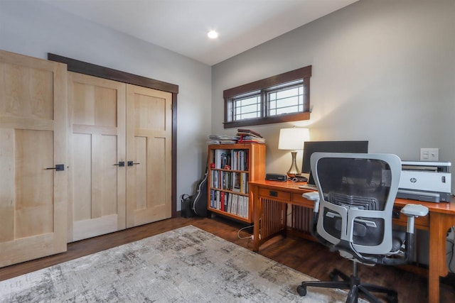 office with dark hardwood / wood-style flooring