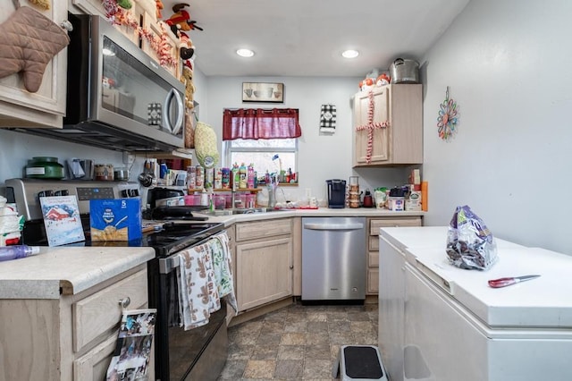 500 E 5th St, Merrill, WI 54452 - kitchen featuring light brown cabinets, stainless steel appliances, and sink
