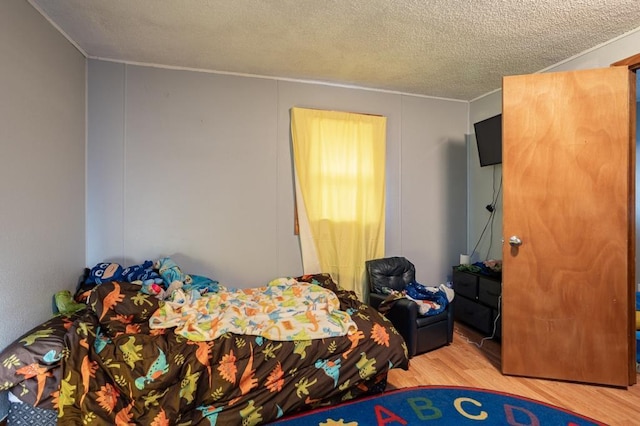500 E 5th St, Merrill, WI 54452 - bedroom featuring a textured ceiling and light hardwood / wood-style flooring