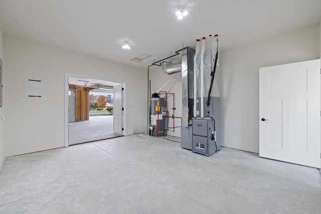 interior space featuring water heater and heating unit