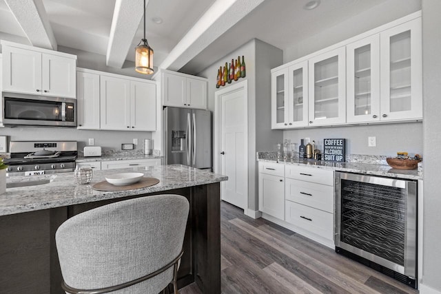 kitchen with white cabinetry, beverage cooler, glass insert cabinets, and stainless steel appliances