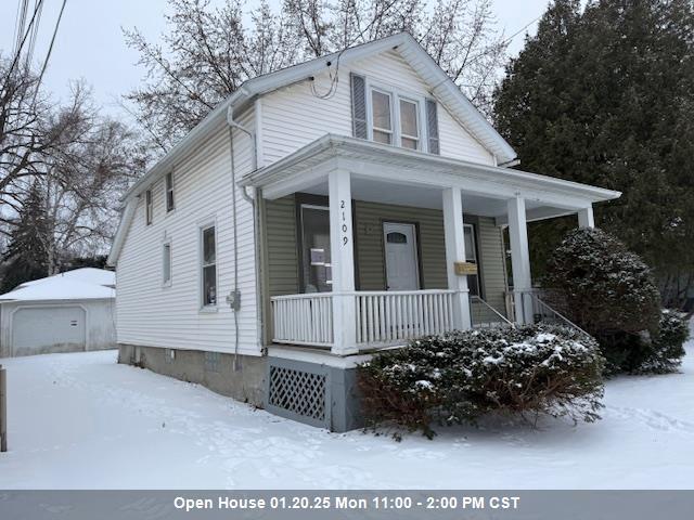 view of front of house featuring a garage and covered porch