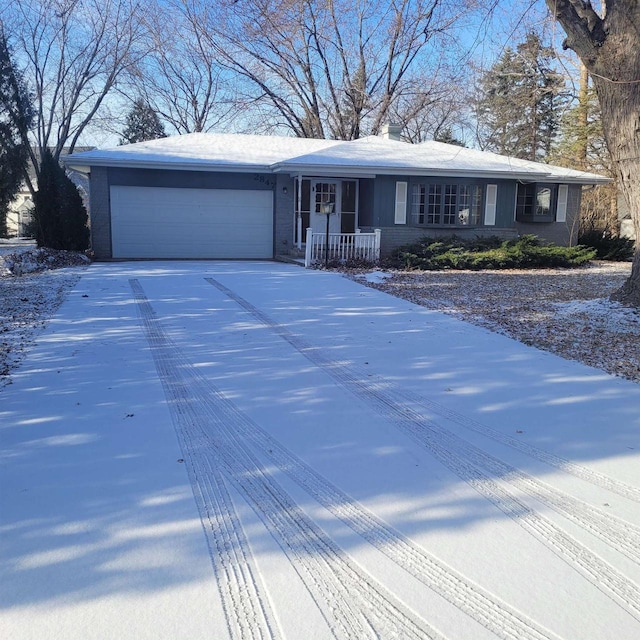 ranch-style house featuring a garage