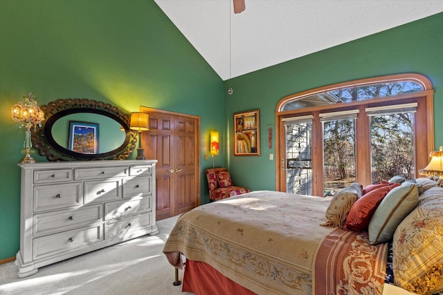 carpeted bedroom with access to outside, high vaulted ceiling, and ceiling fan