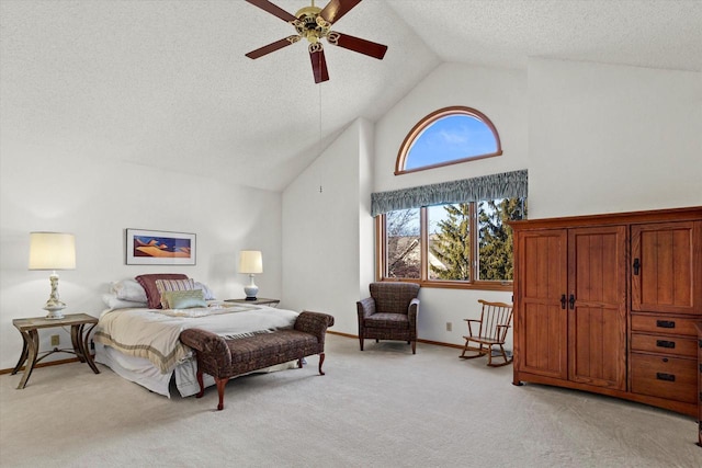 bedroom with ceiling fan, light colored carpet, a textured ceiling, and high vaulted ceiling