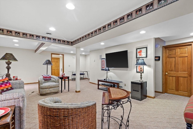 carpeted living room with beamed ceiling