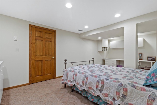 bedroom with light colored carpet