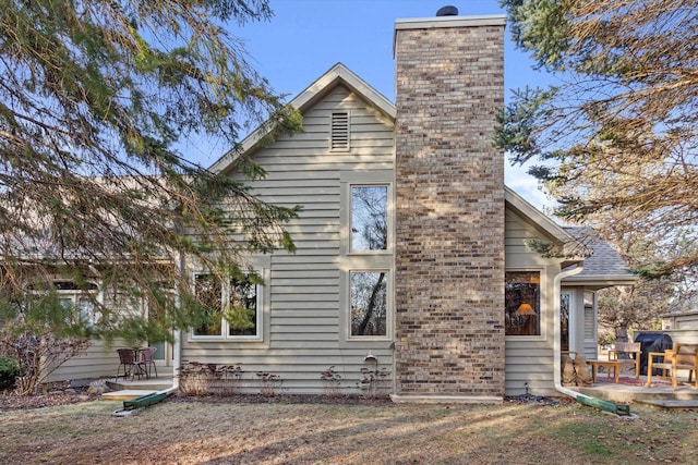 back of house with a patio