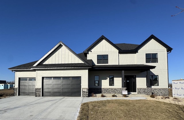 view of front of home with a front yard and a garage