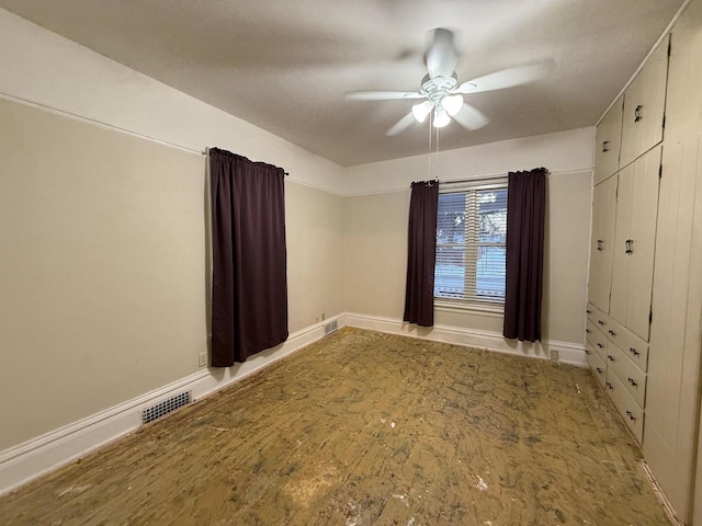 unfurnished room featuring ceiling fan