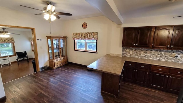 kitchen with ceiling fan, dark hardwood / wood-style floors, decorative backsplash, and dark brown cabinetry