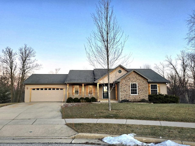 ranch-style home featuring a garage and a front yard