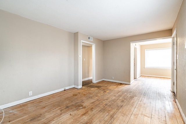 spare room with light hardwood / wood-style flooring