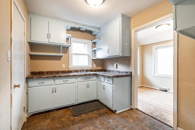 kitchen with white cabinetry and sink