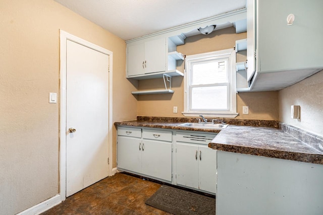 kitchen with sink and white cabinets