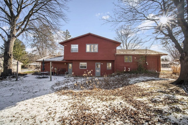 view of snow covered house