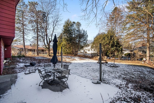 view of yard layered in snow