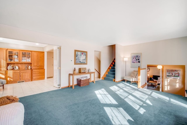 miscellaneous room with light colored carpet