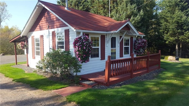 view of outbuilding featuring a lawn