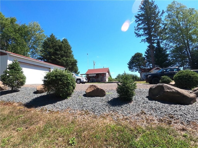 view of yard with a garage