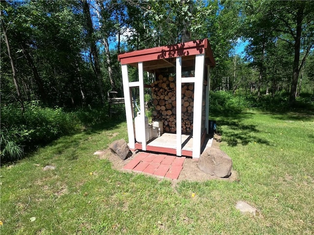 view of outbuilding featuring a lawn