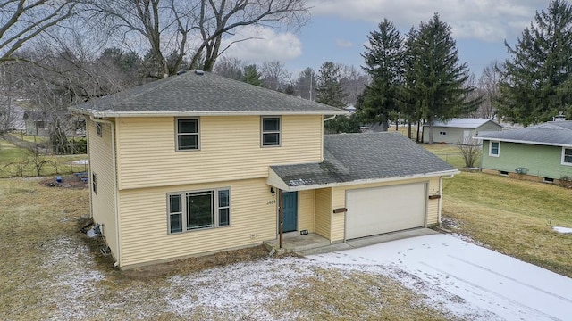 view of front property featuring a garage and a front lawn