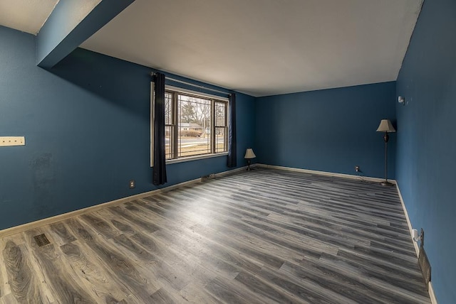 empty room featuring dark hardwood / wood-style floors