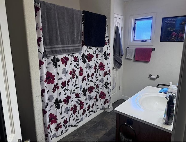 bathroom with vanity and tile patterned flooring