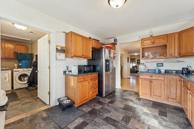 kitchen with stainless steel fridge and washing machine and dryer