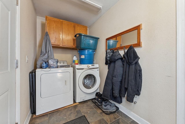 washroom with cabinets and separate washer and dryer