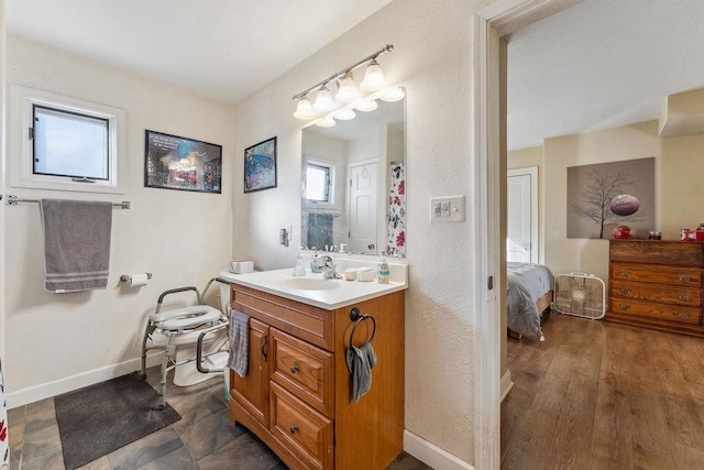 bathroom featuring wood-type flooring and vanity