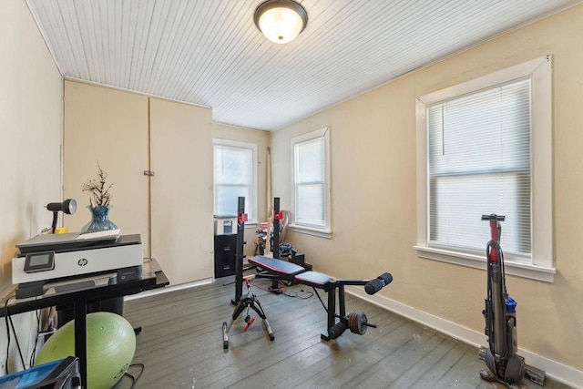 workout area with hardwood / wood-style flooring