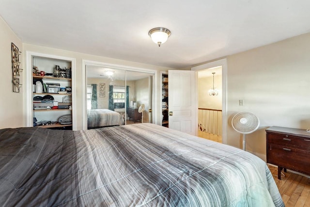 bedroom with a closet and hardwood / wood-style flooring