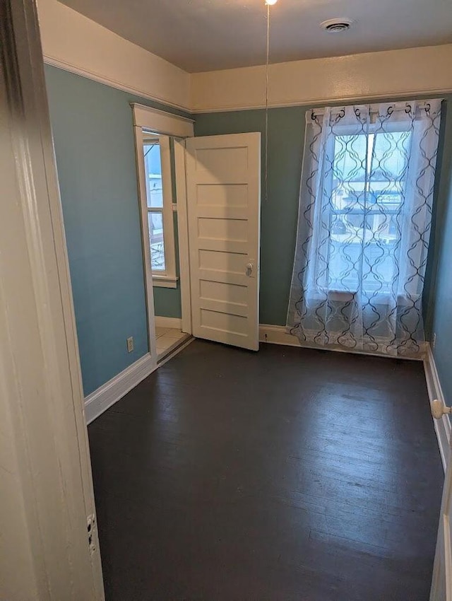 foyer with dark hardwood / wood-style floors