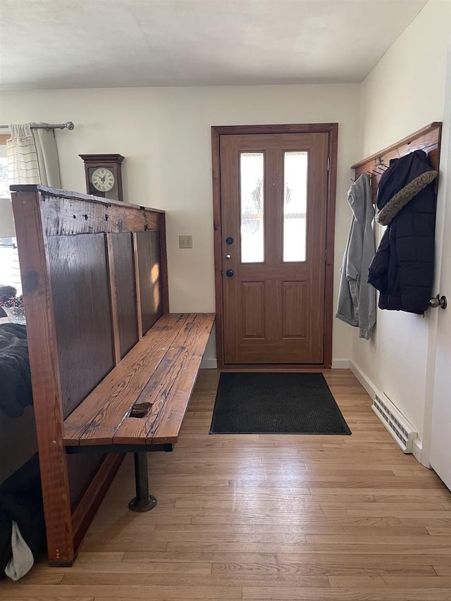 mudroom with light hardwood / wood-style floors