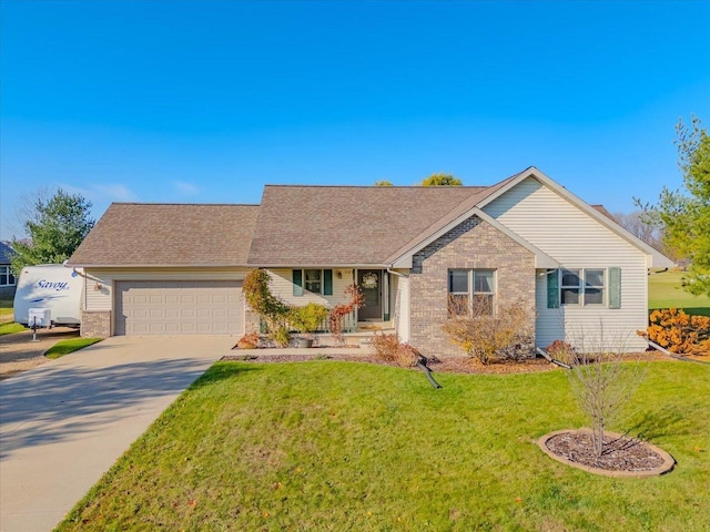 ranch-style house featuring a garage and a front lawn