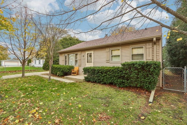 ranch-style home with a front yard