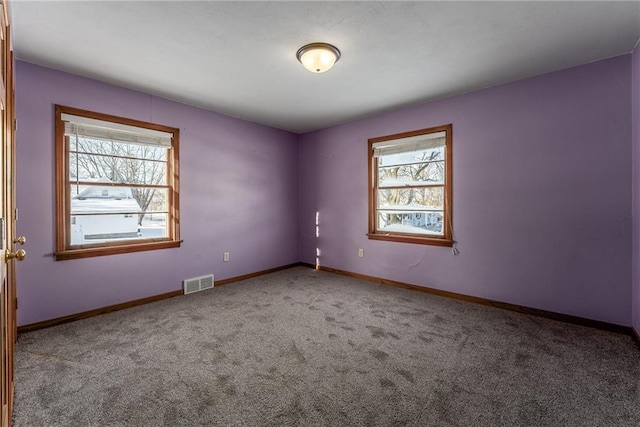 empty room with carpet flooring